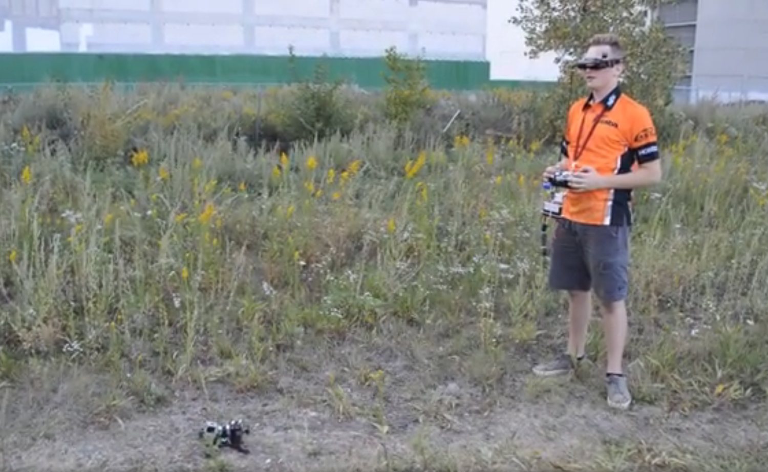 Early FPV pilot operating a drone in an outdoor field